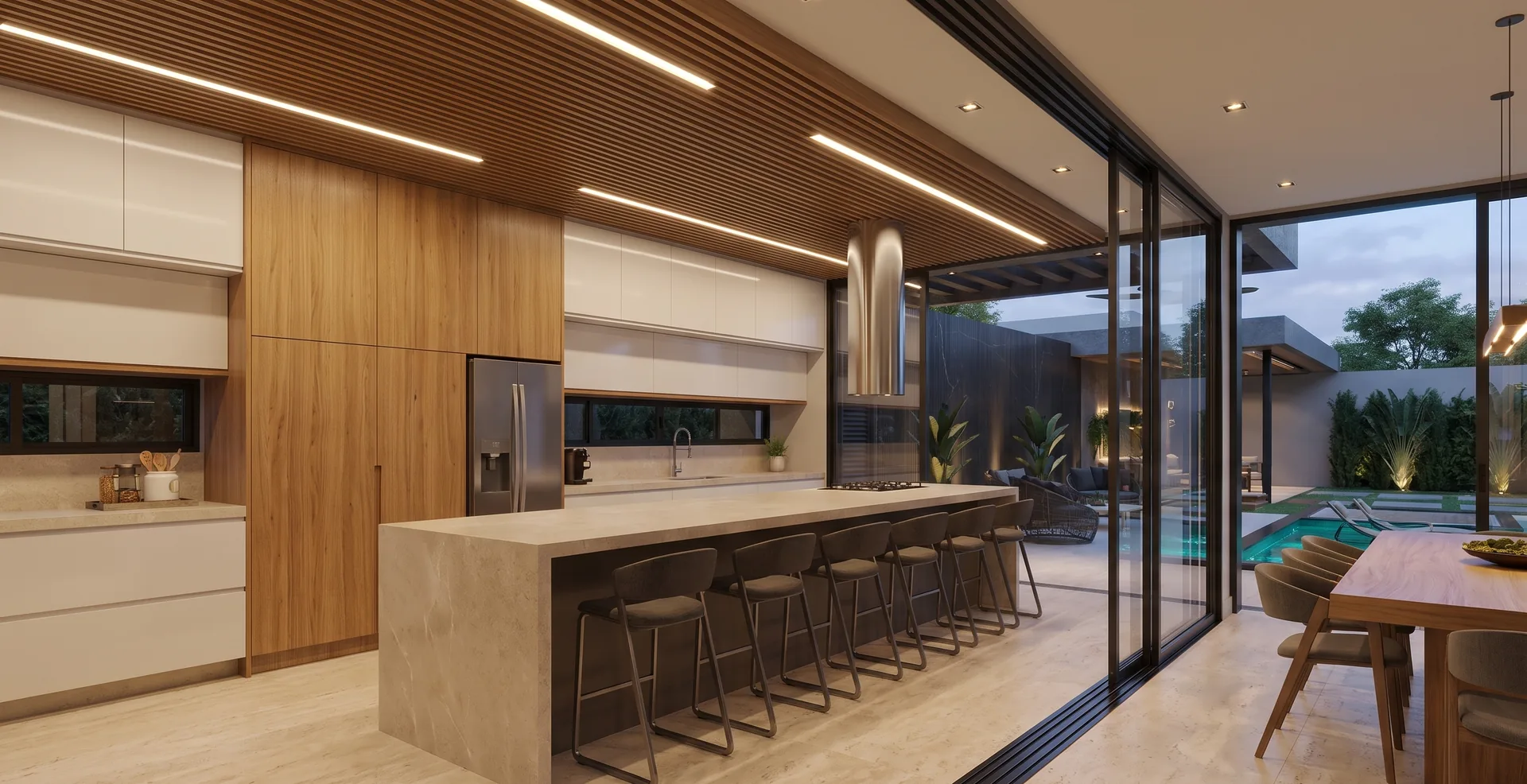 Kitchen with an eight-seat stone island, tall oak cabinetry and an oak slat ceiling, opening onto the dining area and pool